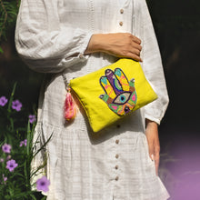 Load image into Gallery viewer, A women posing with beautiful Hamsa Bag Neon Green handbags for women.