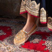Load image into Gallery viewer, A foot of lady who have worn a Diva Gold Espadrilles shoe for women kept upon a mat.