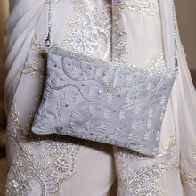 Load image into Gallery viewer, A women posing with beautiful Kaira Silver Bag exclusive handbags for women.