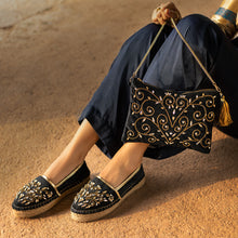 Load image into Gallery viewer, A woman posing with beautiful Diva Black Bag exclusive handbags for women along with matching pair of shoes.