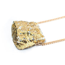Load image into Gallery viewer, An elegant shimmery Sitara micro bag gold kept horizontally towards right side on a white background.