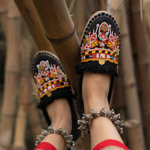 Load image into Gallery viewer, A feet of a model wearing beautiful Masai Beaded Espadrilles Black showcasing juttis for women