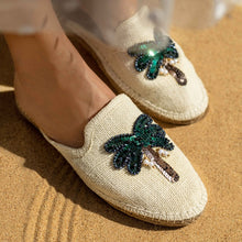 Load image into Gallery viewer, a pair of coco off-white Espadriles flats with green color palm tree on top of it, sitting on a light brown ground
