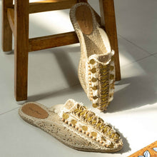 Load image into Gallery viewer, Photo of a pair of Ibiza Espadrilles Flats, featuring a beige canvas upper with yellow and silver stripes on the platform sole. The shoes have a rounded toe.