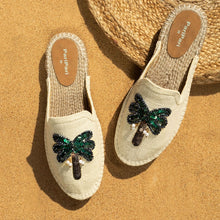 Load image into Gallery viewer, a pair of coco off-white Espadriles flats with green color palm tree on top of it, sitting on a light brown ground