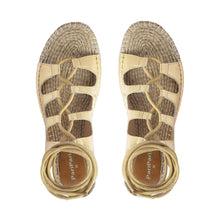 Load image into Gallery viewer, Photo of a pair of gold Gladiator Sandals featuring metallic gold straps on a white background.