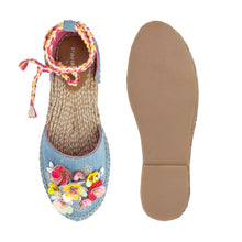 Load image into Gallery viewer, A pair of blue carnation Tie-up Espadrilles, featuring colorful flowers and straps, one view facing forward and the other view facing backwards on a white background.