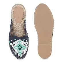 Load image into Gallery viewer, A pair of Go Anywhere Flat Espadrilles, against a white background where one is shown from the sole side