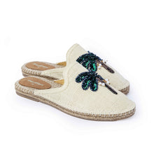 Load image into Gallery viewer, a side view of a pair of coco off-white Espadriles flats with green color palm tree on top of it on a white background