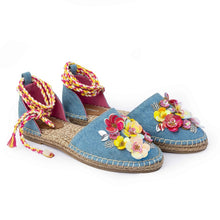 Load image into Gallery viewer, A pair of blue carnation Tie-up Espadrilles, featuring colorful flowers and straps on a white background.