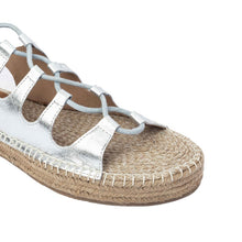 Load image into Gallery viewer, A single silver sandal on a white background