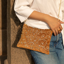 Load image into Gallery viewer, A woman posing with beautiful Diva Gold Bag exclusive handbags for women.
