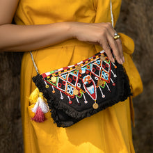 Load image into Gallery viewer, A women posing with Masai Bag Black handbags for women.
