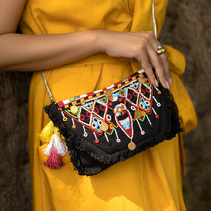 A women posing with Masai Bag Black handbags for women.