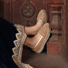 Load image into Gallery viewer, A woman has worn beautiful Diva Gold Espadrilles shoes for women, leaning on a old wall. 
