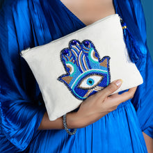 Load image into Gallery viewer, A women posing with beautiful Hamsa Bag Off White handbags for women.
