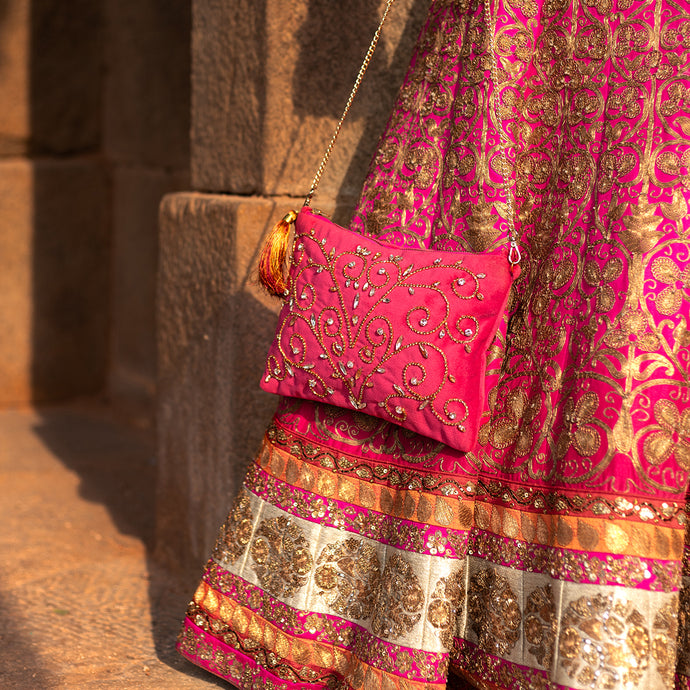 A woman posing with beautiful Diva Rani Pink Bag exclusive handbags for women.