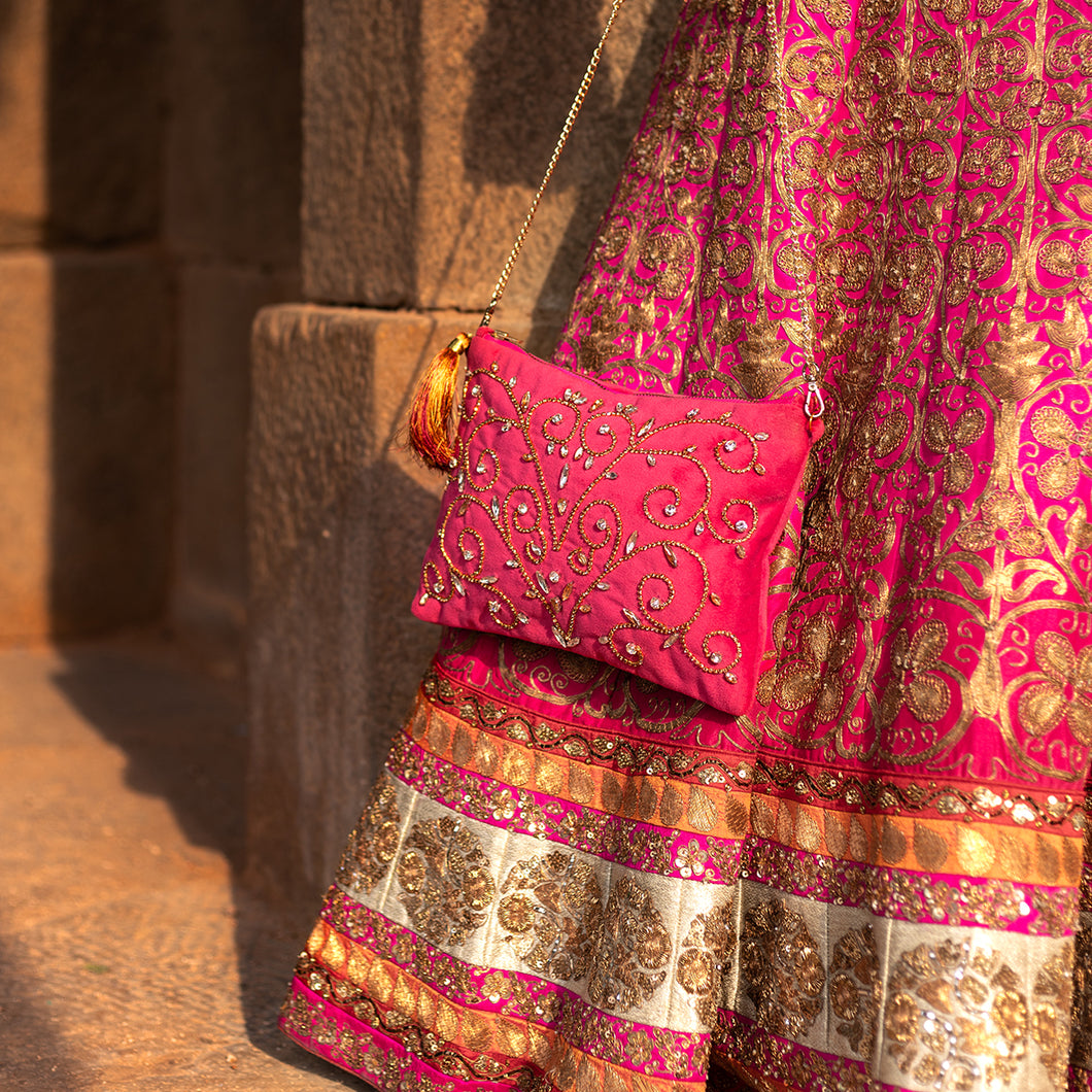 A woman posing with beautiful Diva Rani Pink Bag exclusive handbags for women.