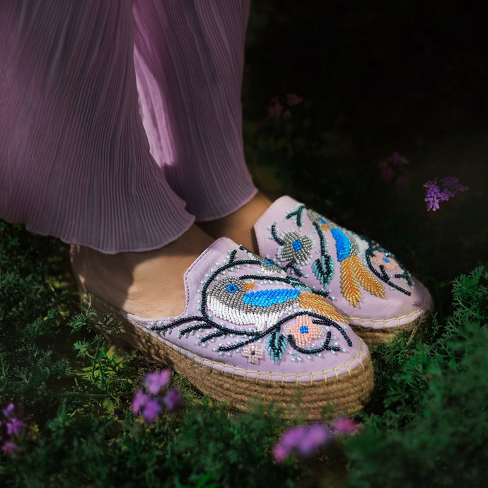 A woman wearing beautiful lavender platforms exclusive ladies shoes.