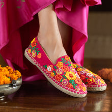 Load image into Gallery viewer, A woman is posing by wearing beautiful Bageecha Pink Espadrilles ladies shoes with some pooja flowers kept beside.
