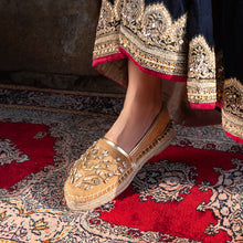 Load image into Gallery viewer, A foot of lady who have worn a Diva Gold Espadrilles shoe for women kept upon a mat.
