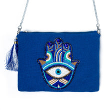 Load image into Gallery viewer, An elegant Hamsa Bag Blue handbags for women kept on a white background.
