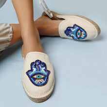 Load image into Gallery viewer, woman wearing a pair of Hamsa off-white espadrilles flats having evil eye protector design
