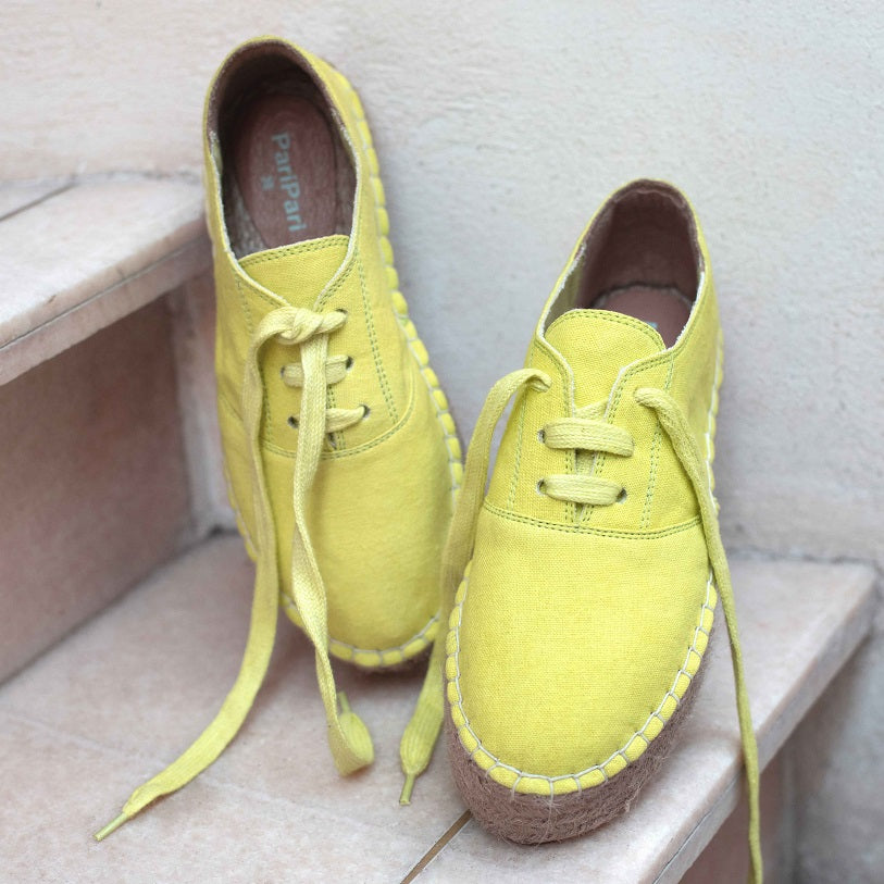 A feet of lady wearing a The Havana Lace-ups - Ladies Fancy Lime Shoes for Women