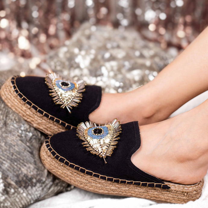Feet of women wearing a  Sleek Evil Eye Glare Espadrilles Charcoal Haut Platform, shoes for Women