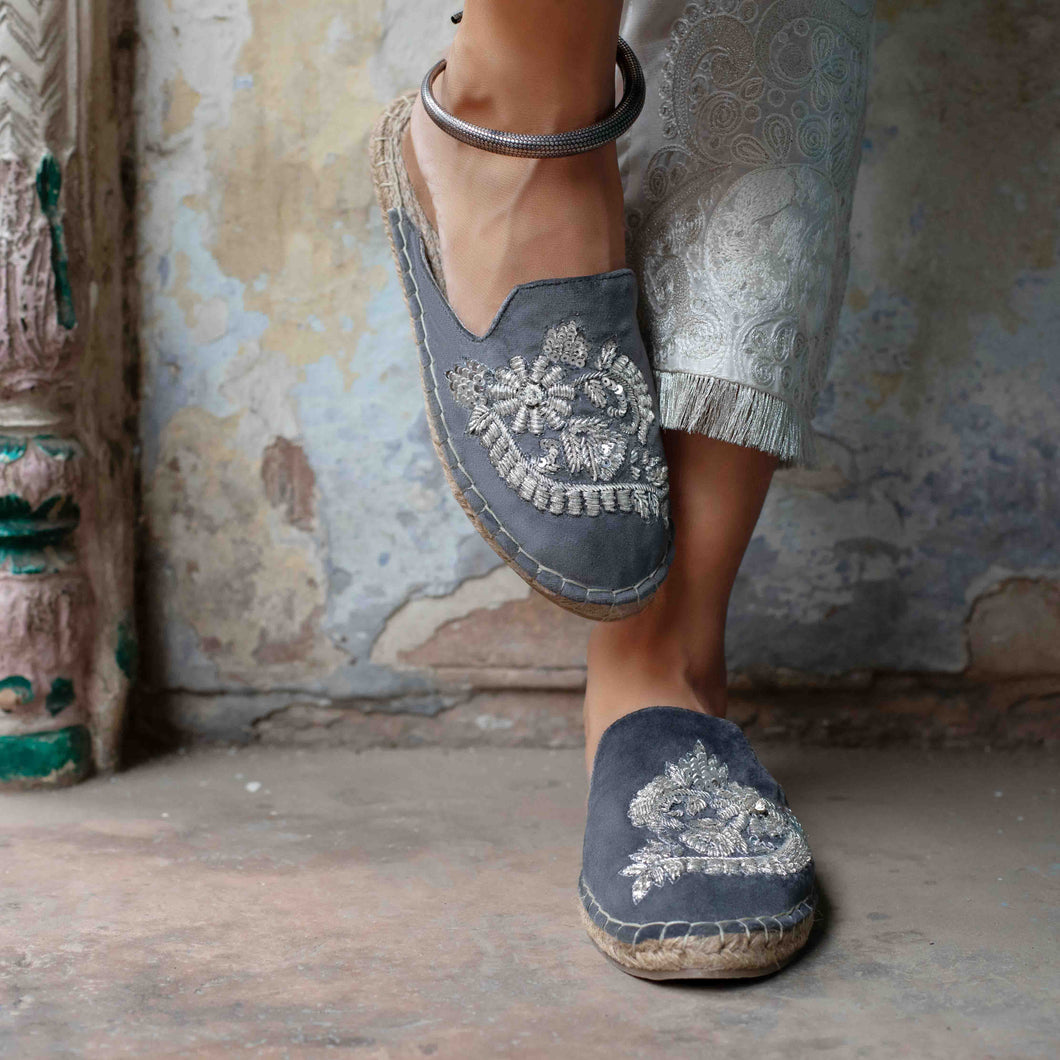 Feet of a model wearing beautiful Ottoman Silver Espadrilles Flats showcasing juttis for women with a kada in the right leg