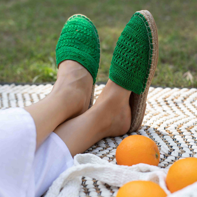 A feet of a model wearing beautiful Croshia Green Espadrilles flats showcasing juttis for women