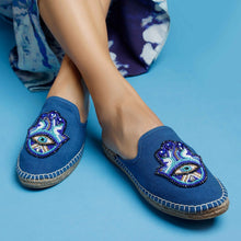 Load image into Gallery viewer, woman wearing a pair of Hamsa Blue espadrilles flats having evil eye protector design kept against a light blue background
