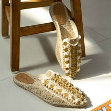 Load image into Gallery viewer, Photo of a pair of Ibiza Espadrilles Flats, featuring a beige canvas upper with yellow and silver stripes on the platform sole. The shoes have a rounded toe.
