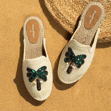 Load image into Gallery viewer, a pair of coco off-white Espadriles flats with green color palm tree on top of it, sitting on a light brown ground
