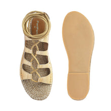 Load image into Gallery viewer, Photo of a pair of gold Gladiator Sandals featuring metallic gold straps, one view facing forward and the other view facing backwards on a white background.

