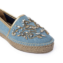 Load image into Gallery viewer, Photo of a single blue Espadrilles with a small embroidery of gold detailing on them with a pattern around the bottom and sides on a white background.
